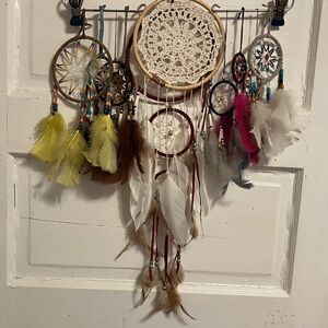 Like new.  Set of 10 various size , colors n styles dream catchers- window